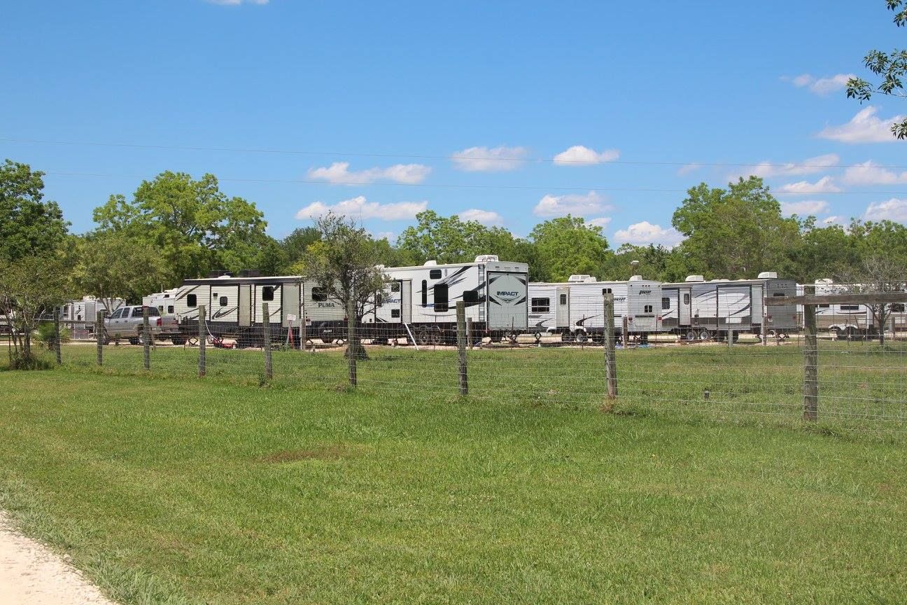Full-hookup RV sites across the park lawn