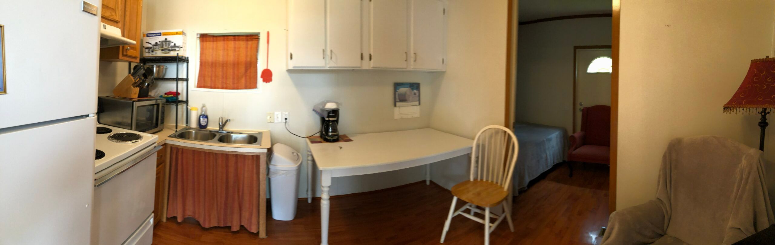 Full kitchen and dining area inside the park's mini-house